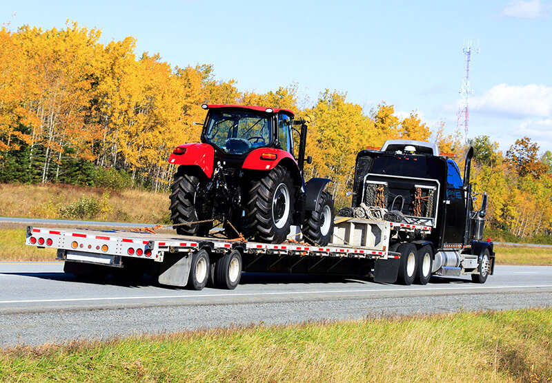 Semi Trailer Transporting a Tractor